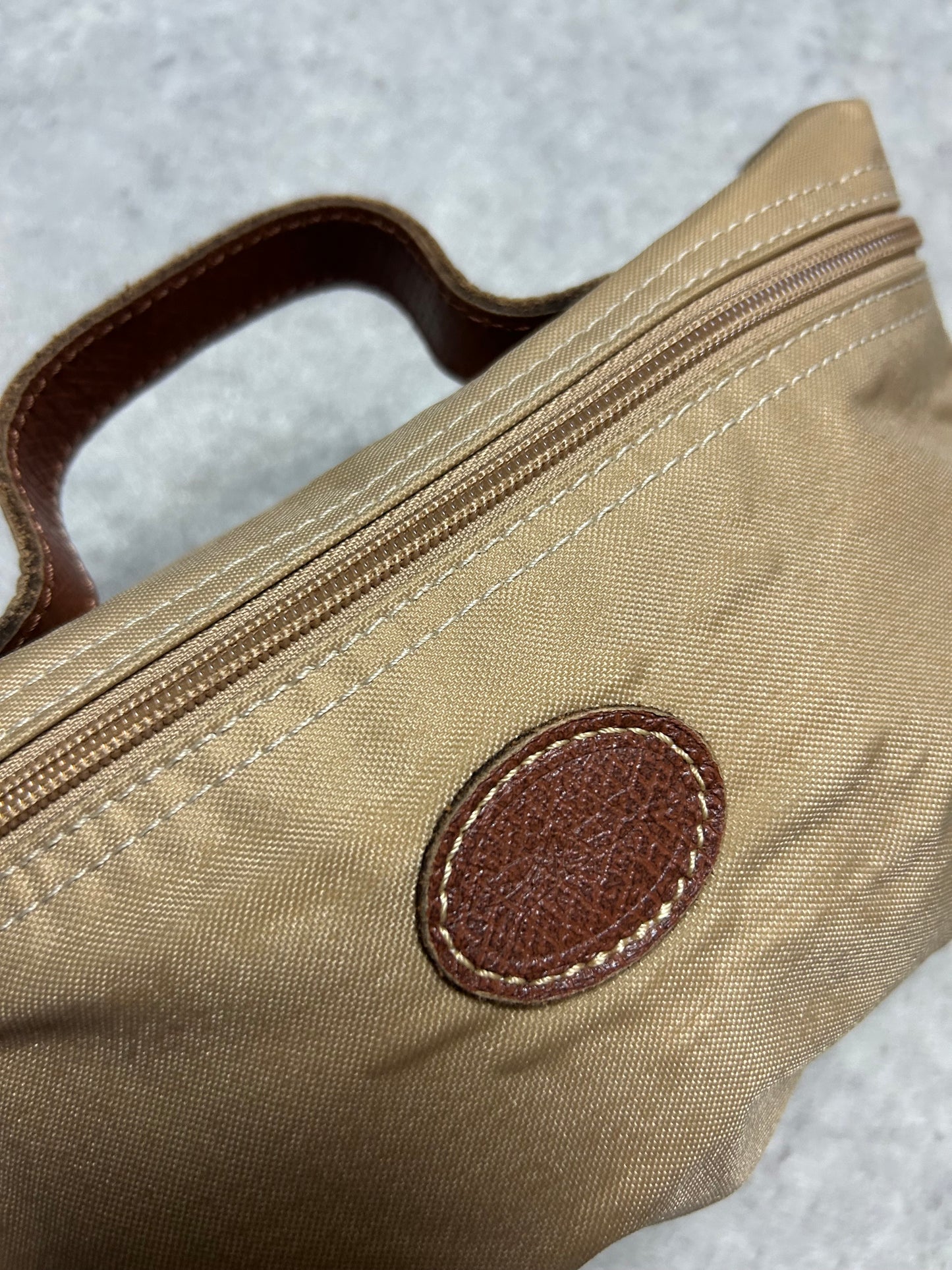 Pochette Longchamp en toile beige trousse pliage